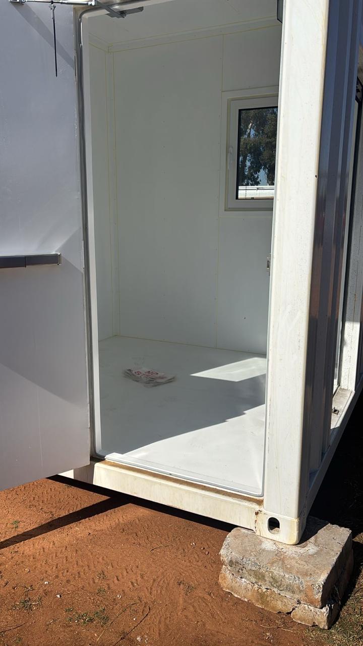 Pump bay open, showing access door and interior